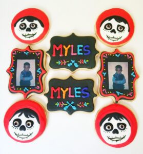Eight red Myles decorated Cookies