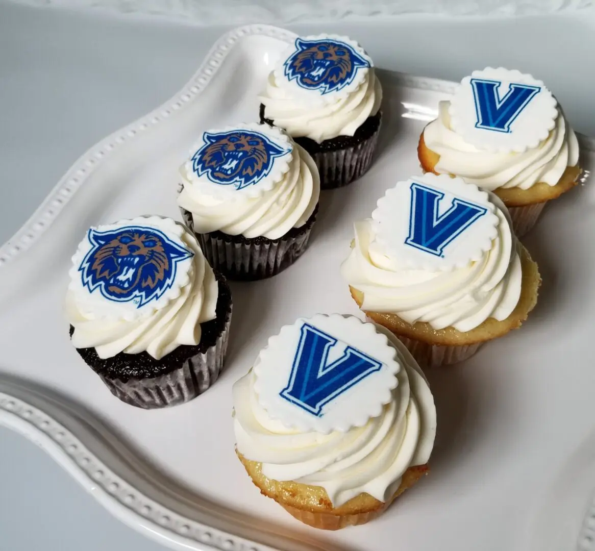 Six lion and V topping decorated Cupcakes