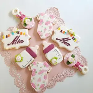Eight white and purple decorated Cookies