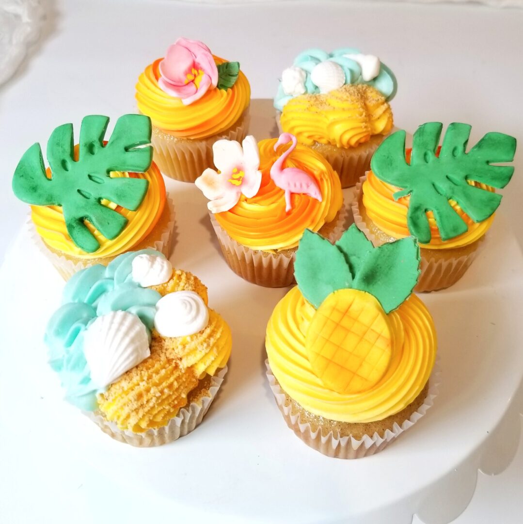 Seven yellow and green topping decorated Cupcakes