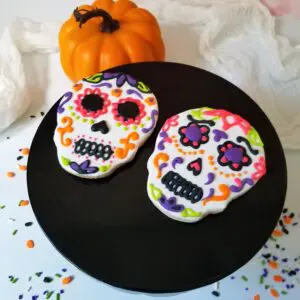 Two skeleton face decorated Cookies