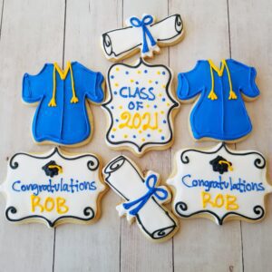 Seven white and blue dress decorated Cookies