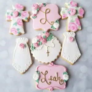 Seven white and pink decorated Cookies