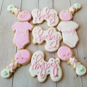 Nine white and pink decorated Cookies