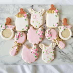 Eleven white and pink decorated Cookies