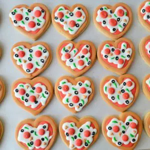 Twelve heart shape decorated Cookies