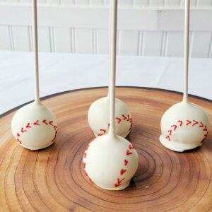 Four white and red decorated Cake Pops