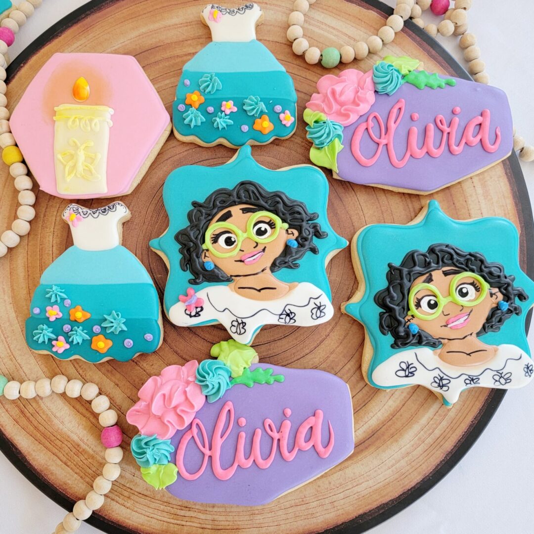 Seven Olivia decorated Cookies
