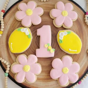 Seven pink and yellow decorated Cookies