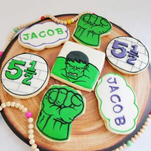 Seven white and green decorated Cookies