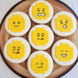 Seven yellow smiley decorated Cookies