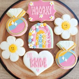 Seven pink and white bride decorated Cookies