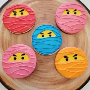 Five colorful smiley decorated Cookies