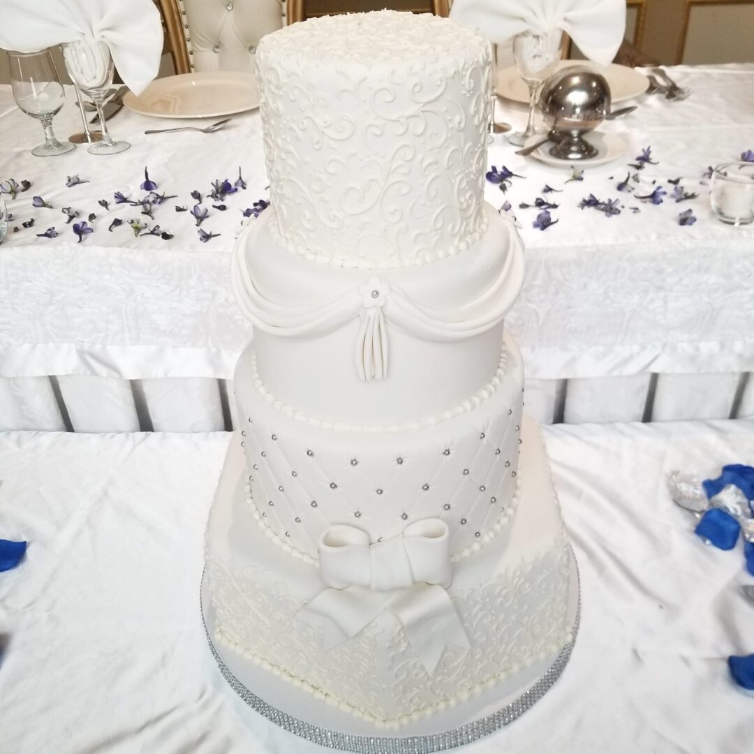Four tier white decorated Wedding Cake