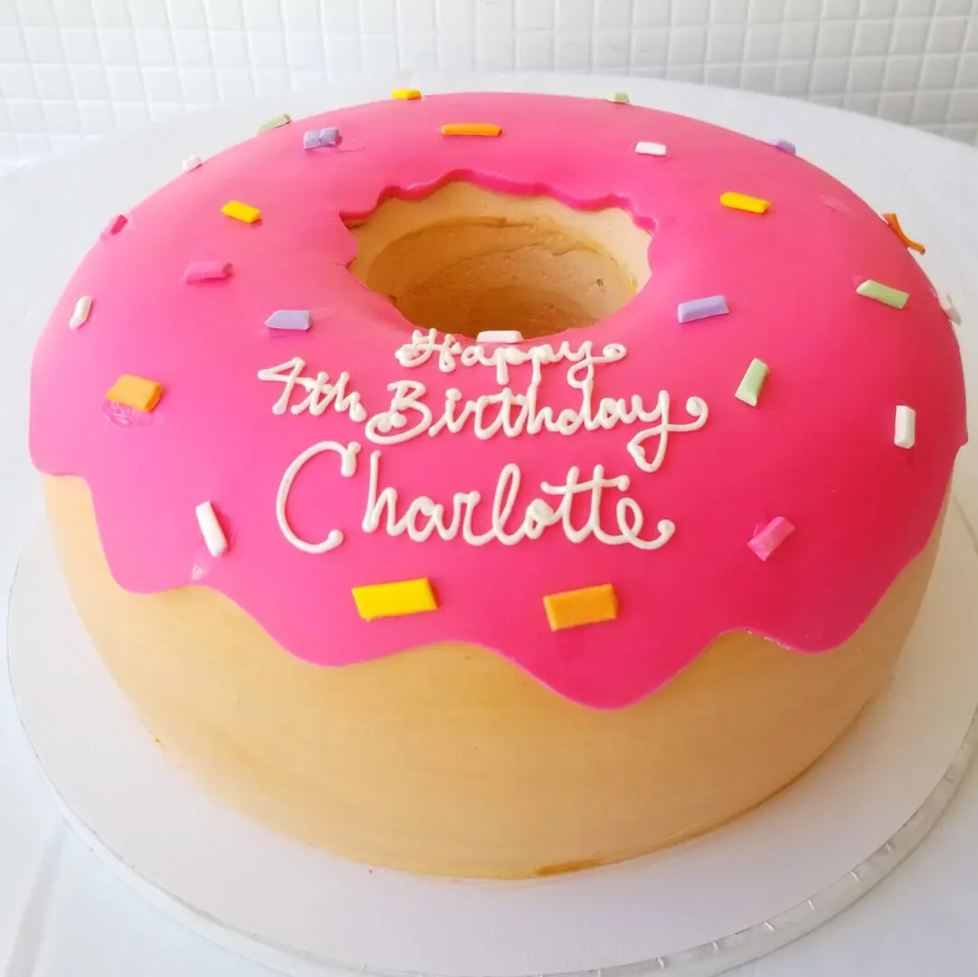 Pink donut 4th Girl Birthday Cake
