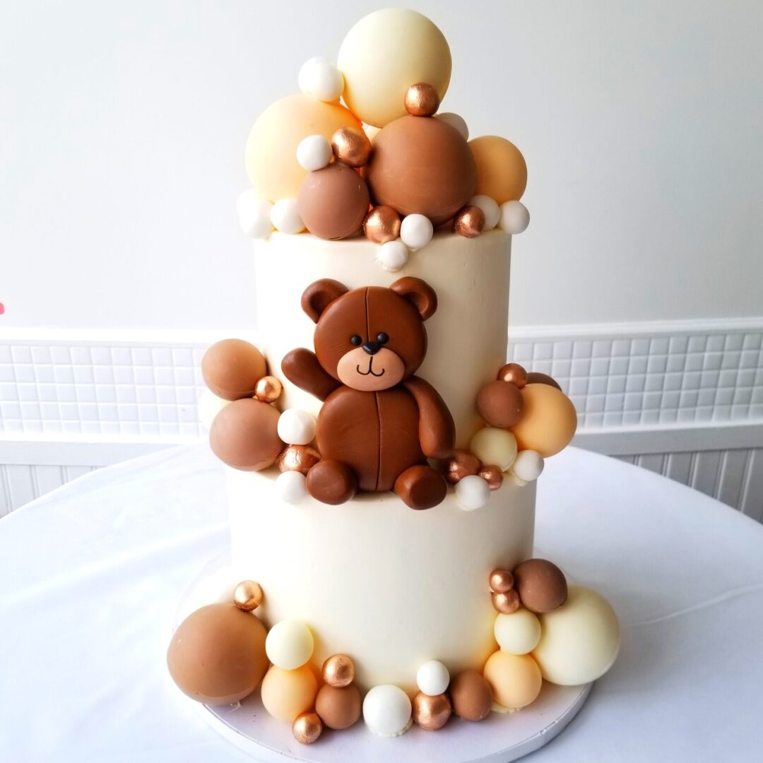 A layered cake with a bear design