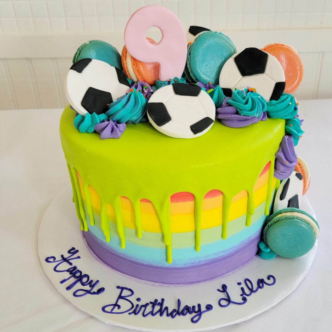 Cookies with football 9th Lila Girl Birthday Cake