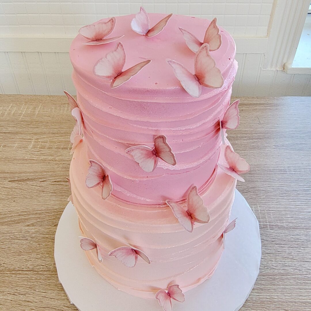 Two tier pink butterfly decorated Girl Birthday Cake