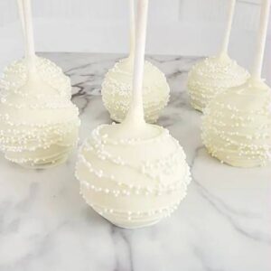 A white cake pop sitting on top of a table.